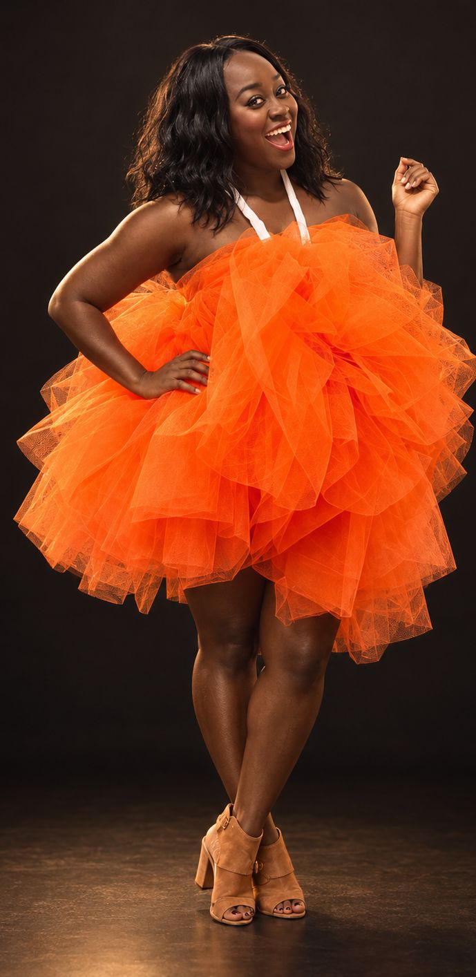 The Loofah costume: a full, round tangerine tulle pouf with white rope straps.